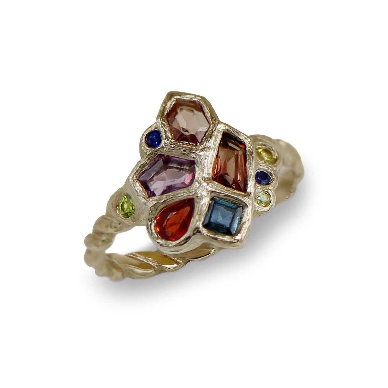 Gold ring with multicolored gemstones on a white background