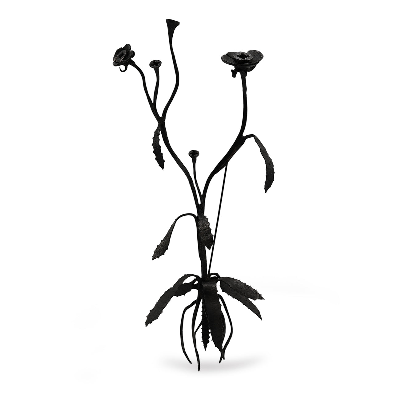 Black metal flower sculpture brooch on a white background