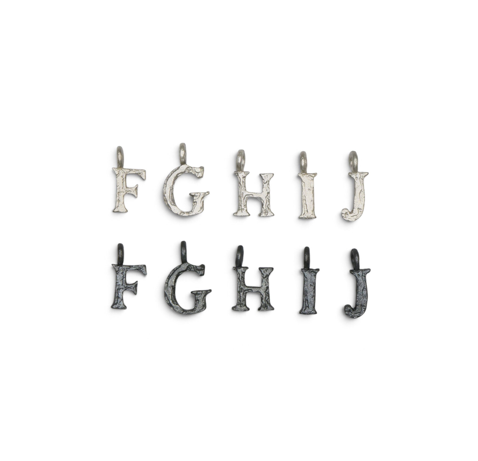 Nine silver-toned metal letter charms from F to J, arranged in two rows of five and four on a plain white background.