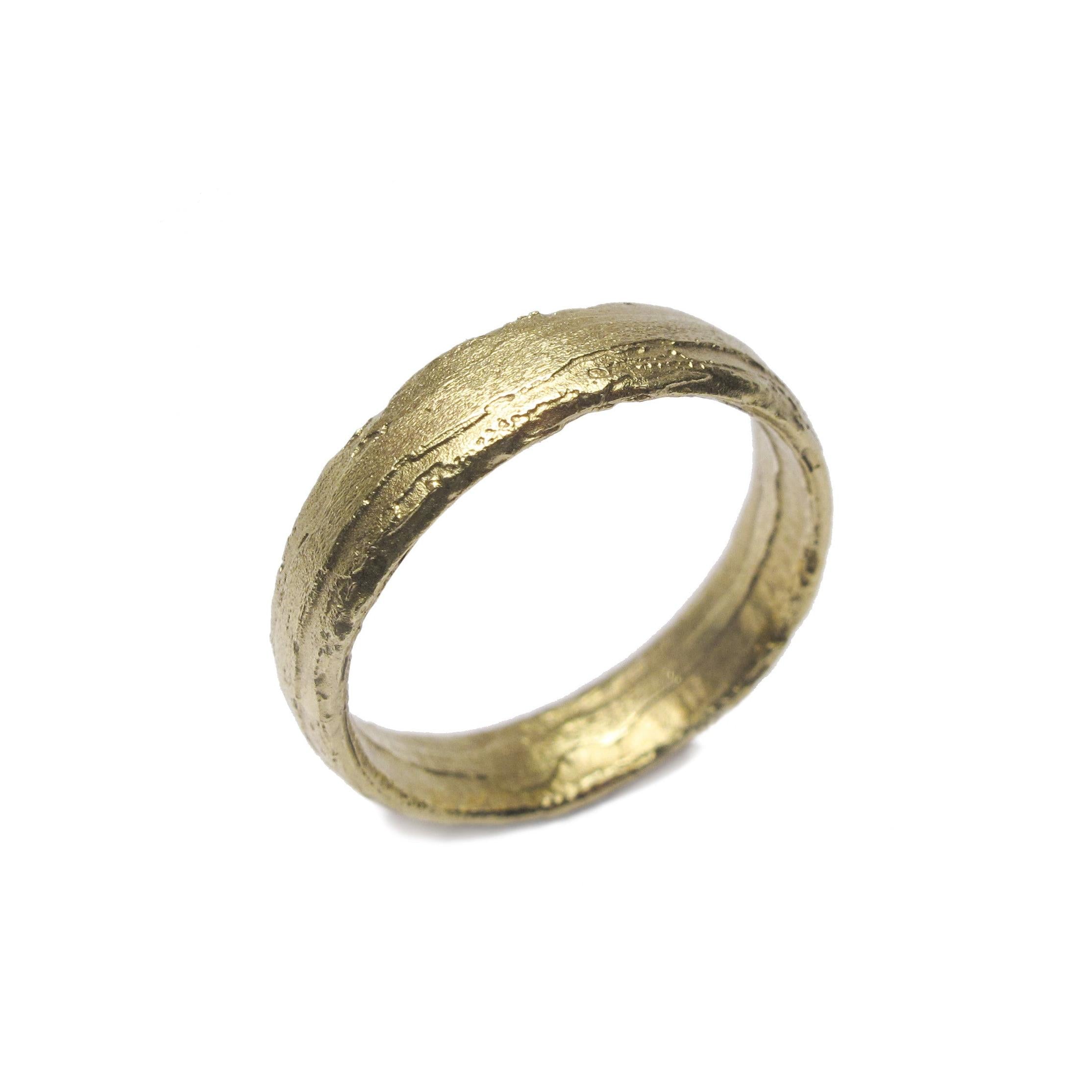 Diana Porter Jewellery unique green gold wedding ring on white background