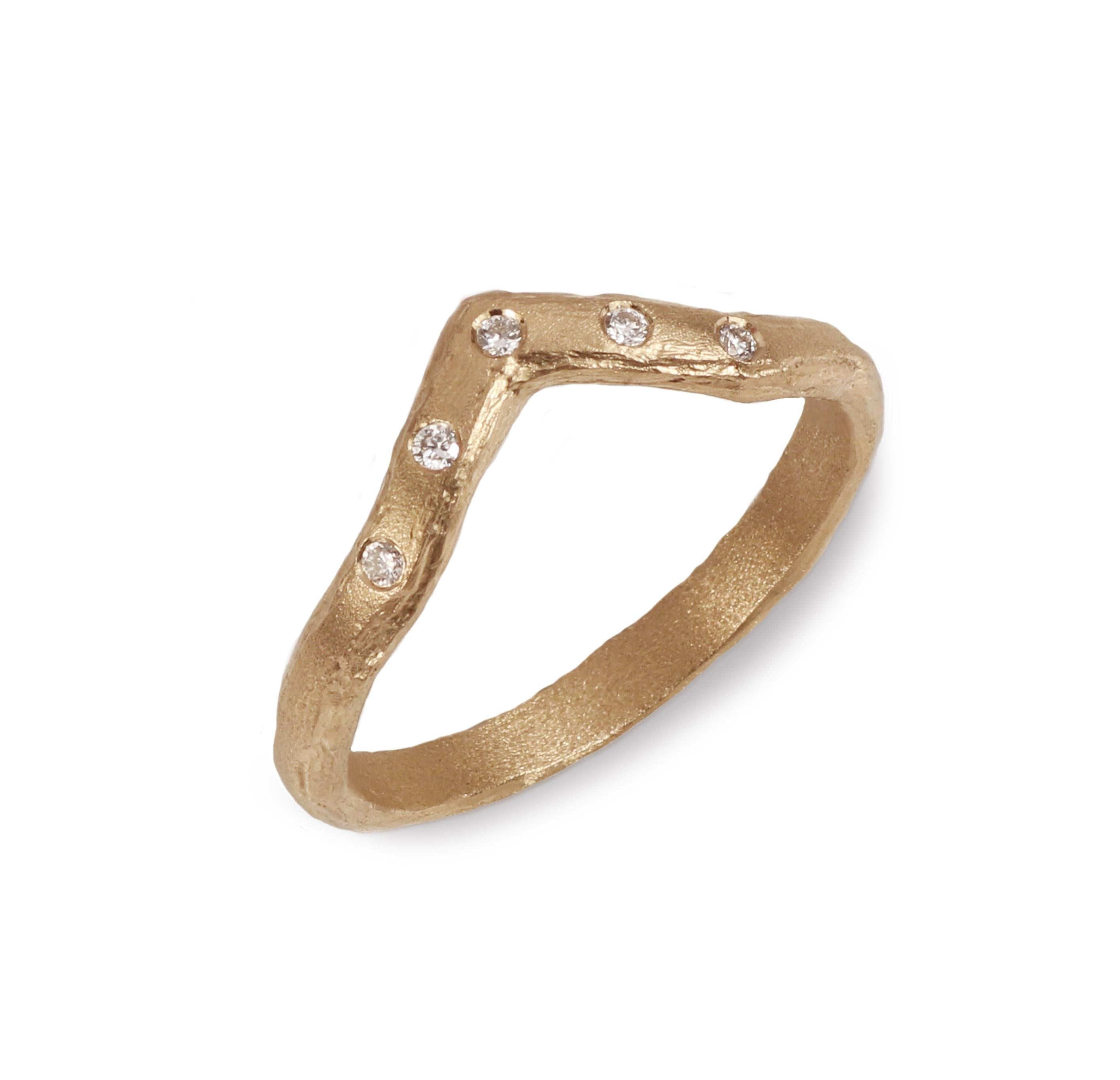 Textured Gold Wishbone Ring With five Diamonds on a white background 