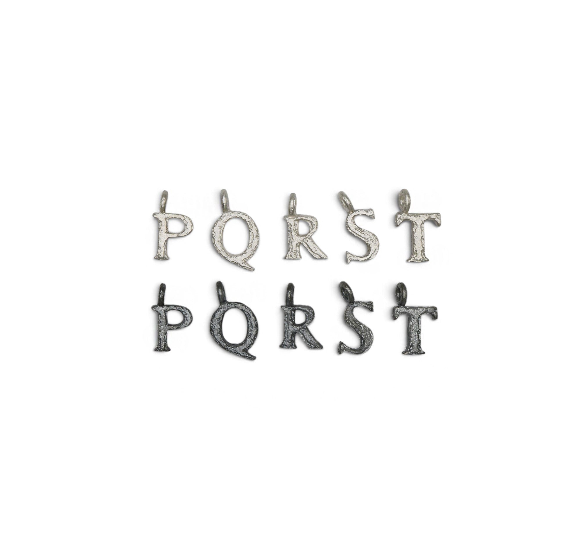 Textured letter charms P - T on a white background. 