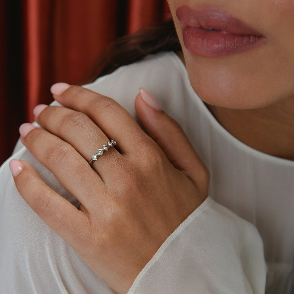 Modern White Gold Eternity Ring With Princess Cut Diamonds