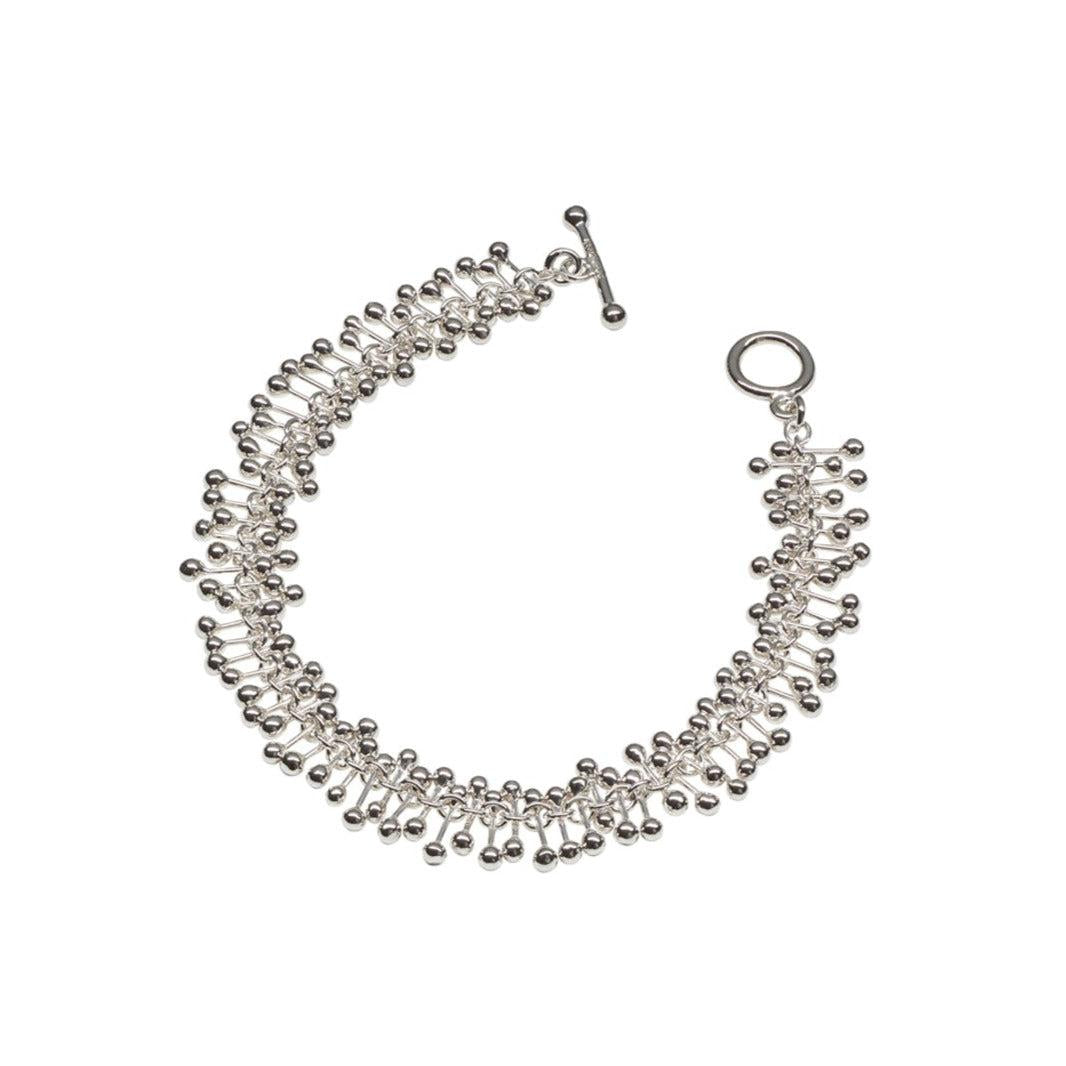 Silver beaded necklace on a white background