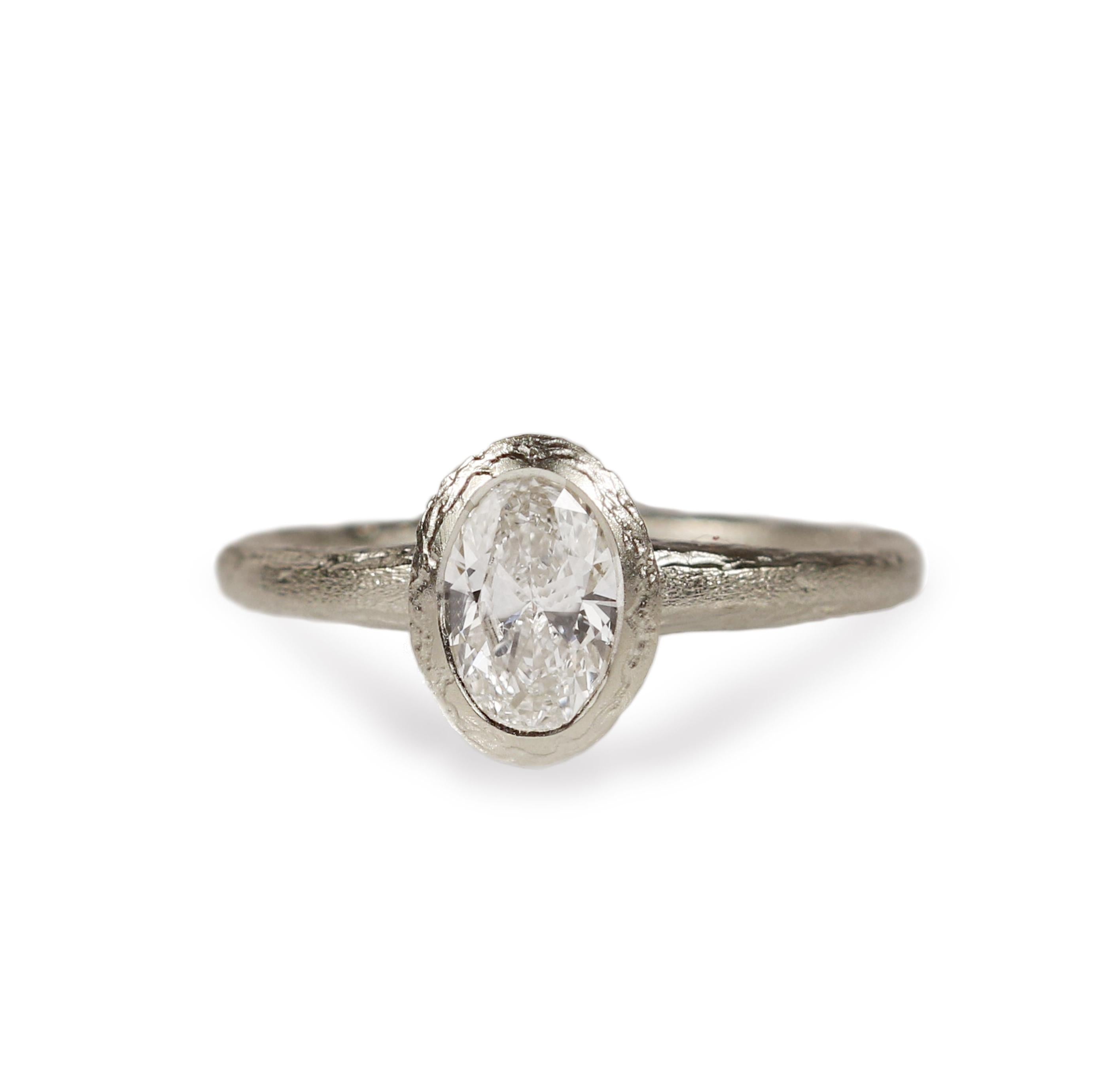 White Gold Engagement Ring Set with Oval Lab Grown Diamond on white background 