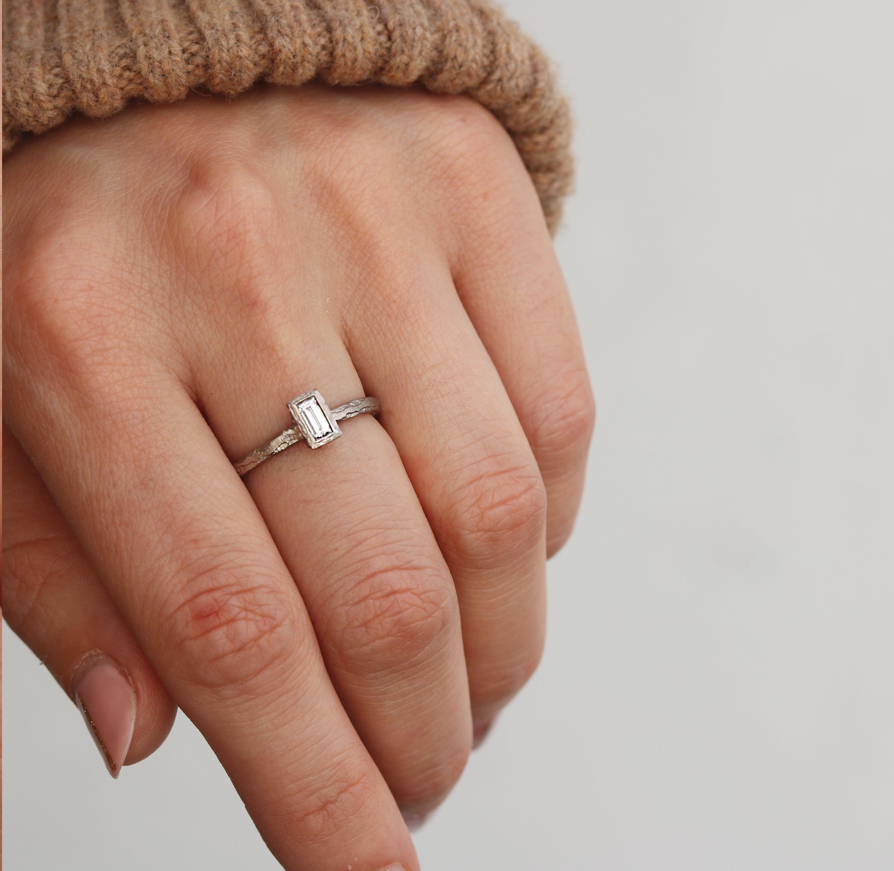 Baguette Cut Diamond Textured Engagement Ring  worn on hand 
