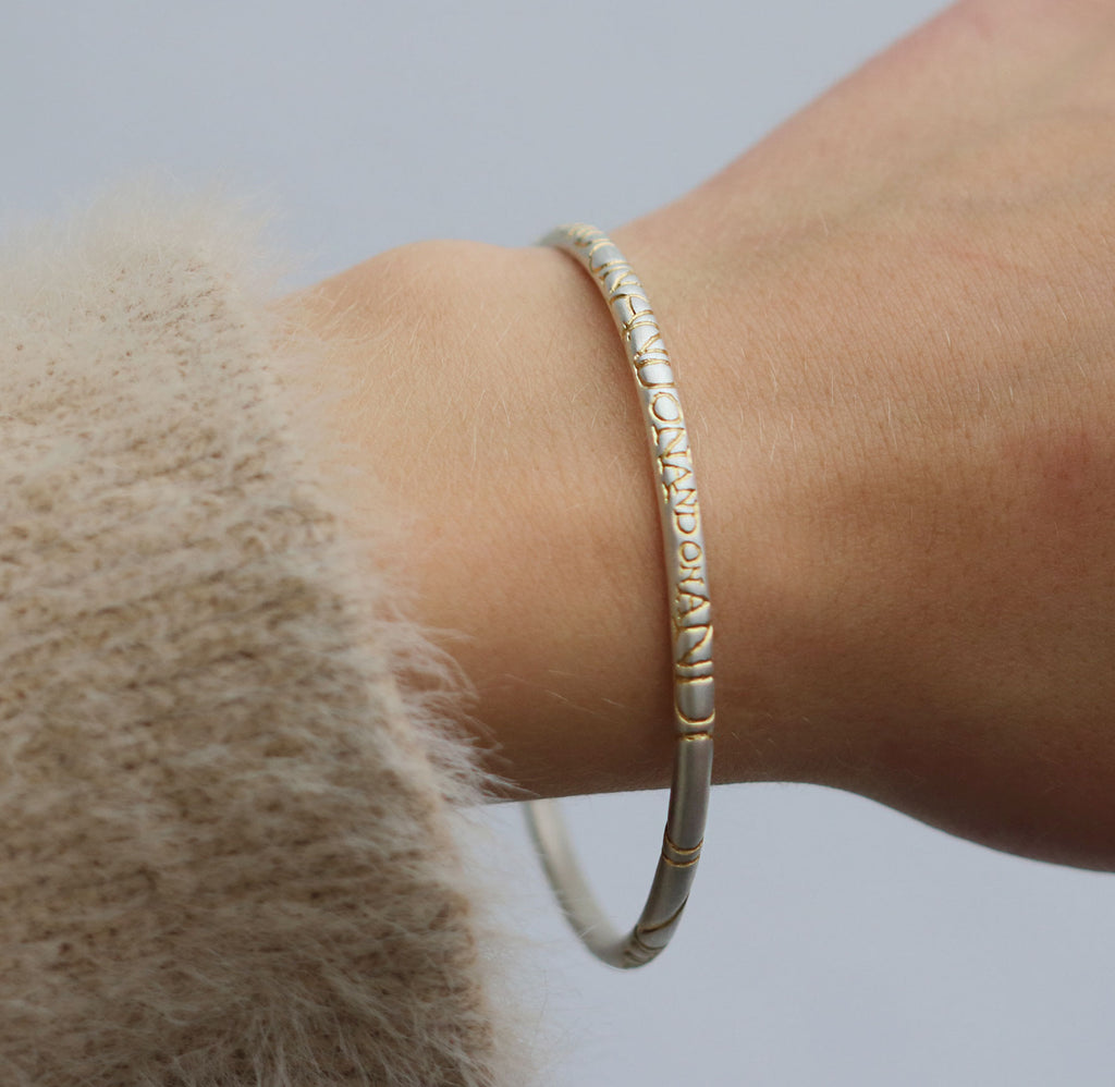 Rounded Silver 'ON AND ON' Bangle