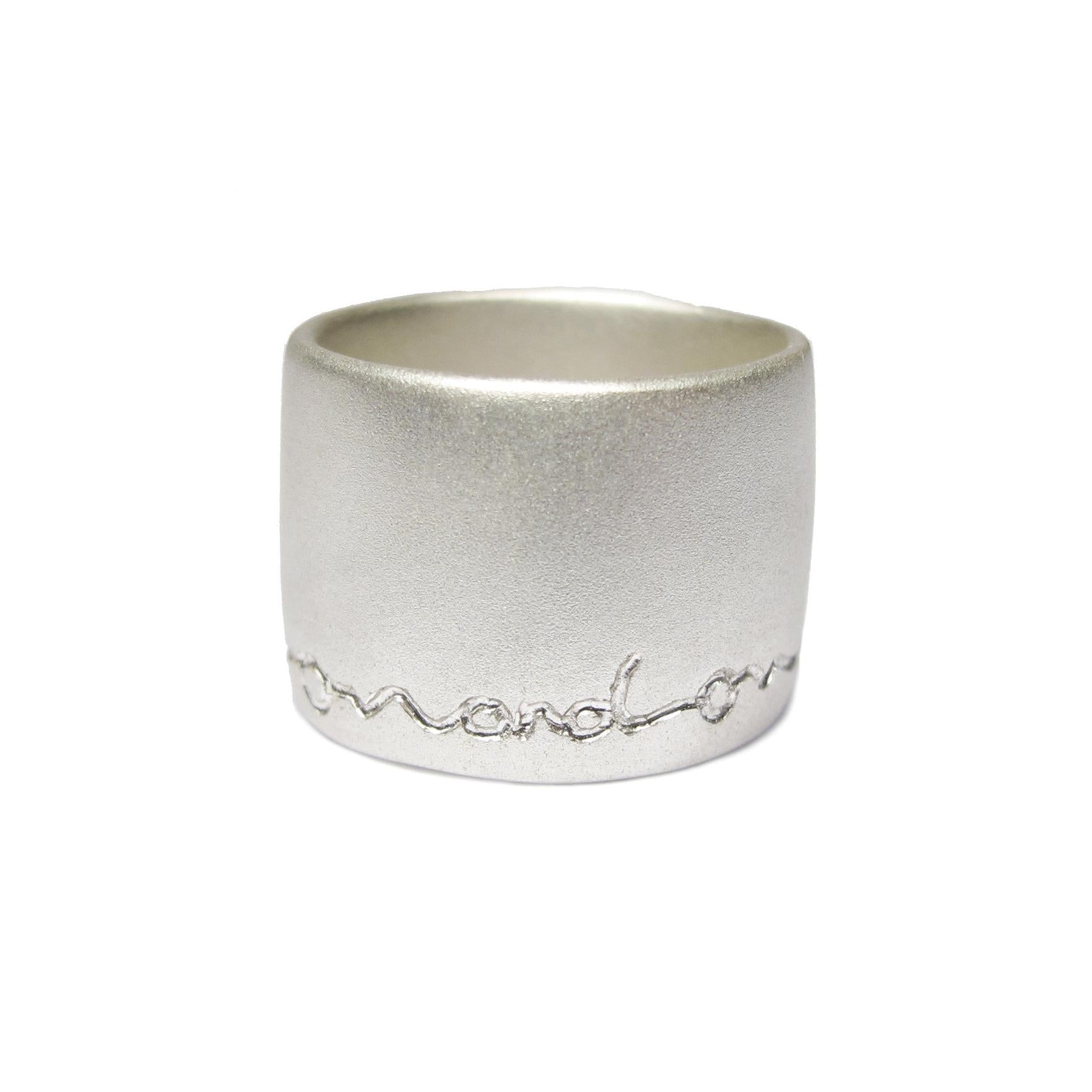 wide silver ring etched on and on by Diana Porter contemporary Jeweller