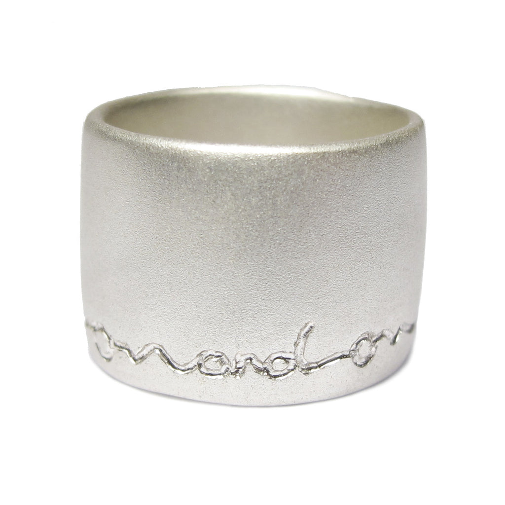 wide silver ring etched on and on by Diana Porter contemporary Jeweller