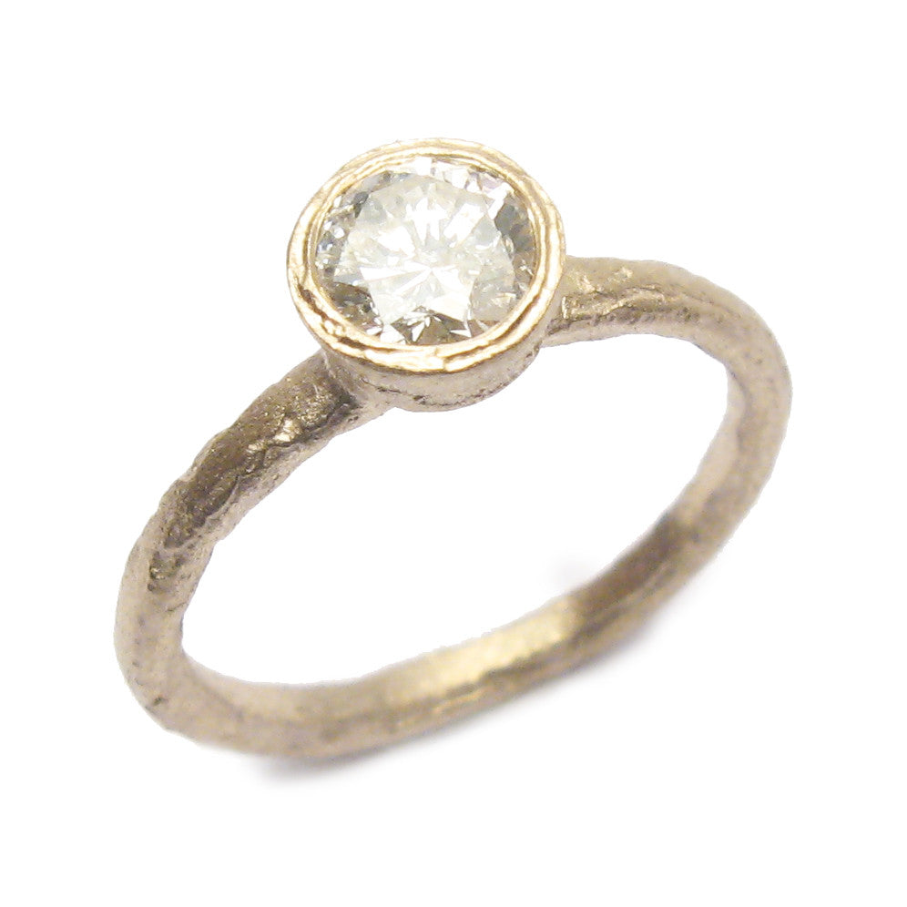 Solitaire White Gold Brilliant Cut Diamond Engagement Ring on white background 
