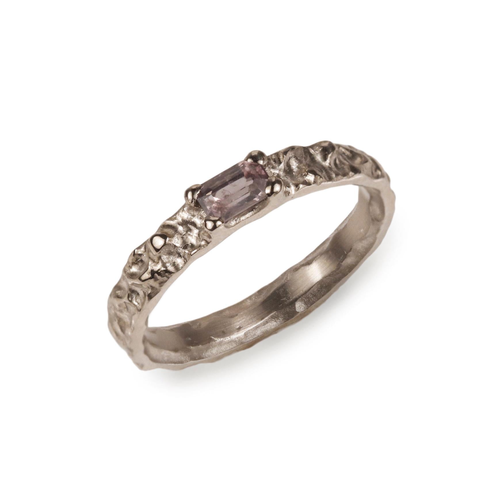 Modern Molten Ring with Purple Tanzanian Spinel on white background 