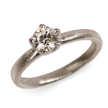 Platinum Ring Set with a Brilliant Cut Diamond in an Irregular Claw Setting