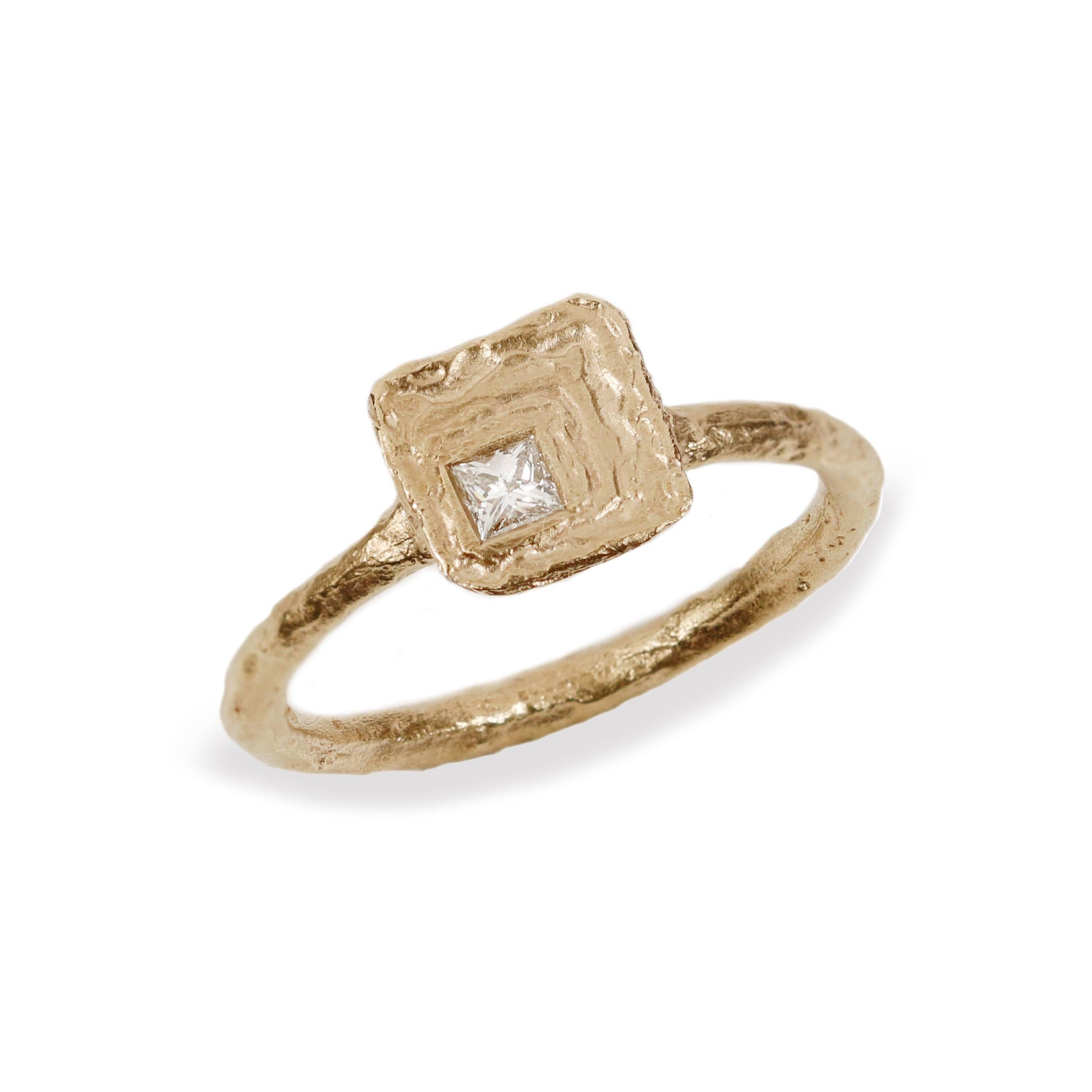 Textured Yellow Gold Ring with Princess Cut Diamond  on white background 