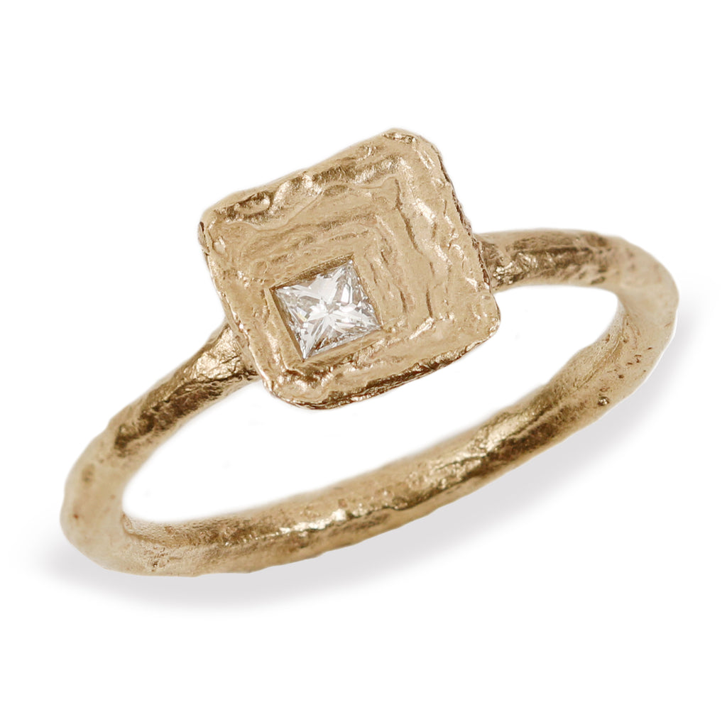 Textured Yellow Gold Ring with Princess Cut Diamond  on white background 