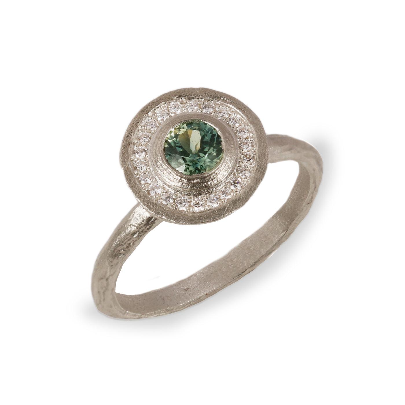  White Gold Halo Engagement Ring with a Green Sapphire and Halo of Diamonds on white background 