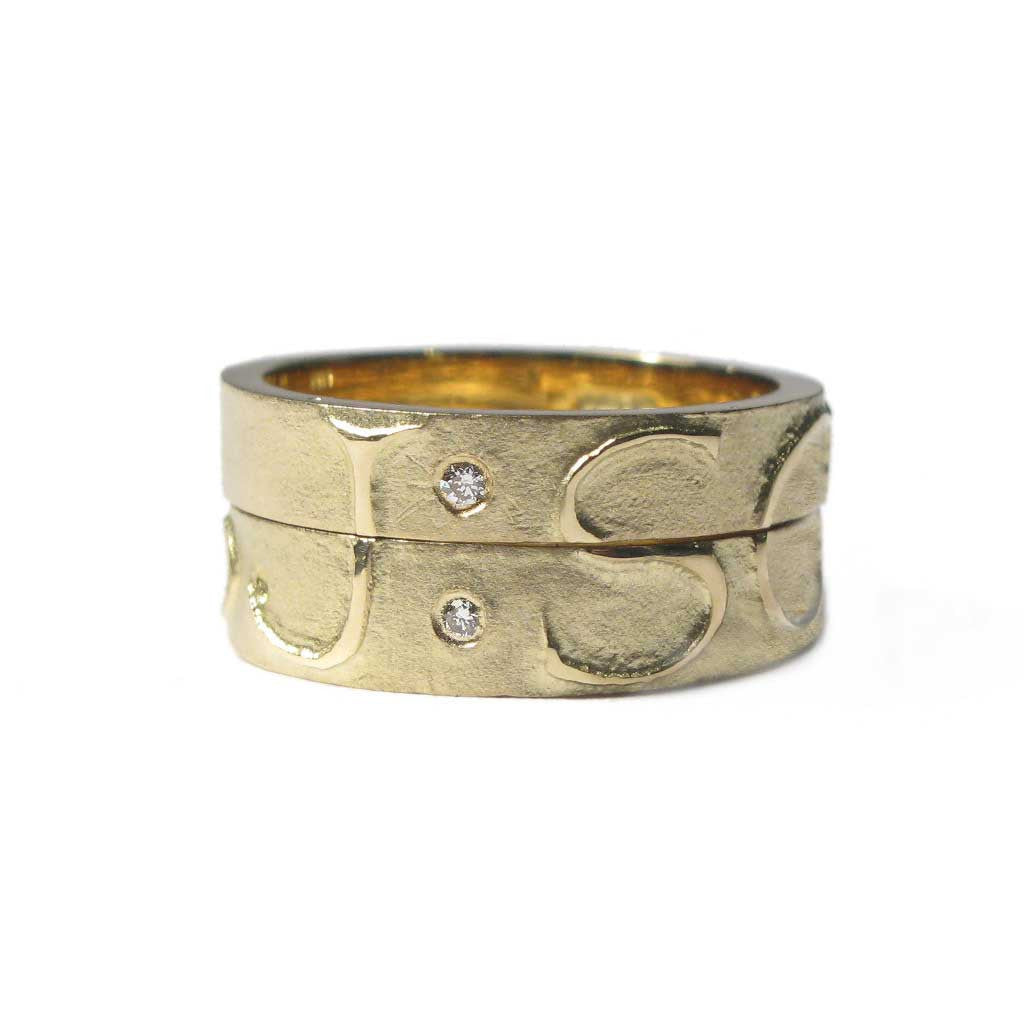 Diana Porter Jewellery bespoke commission etched yellow gold diamond partnership rings