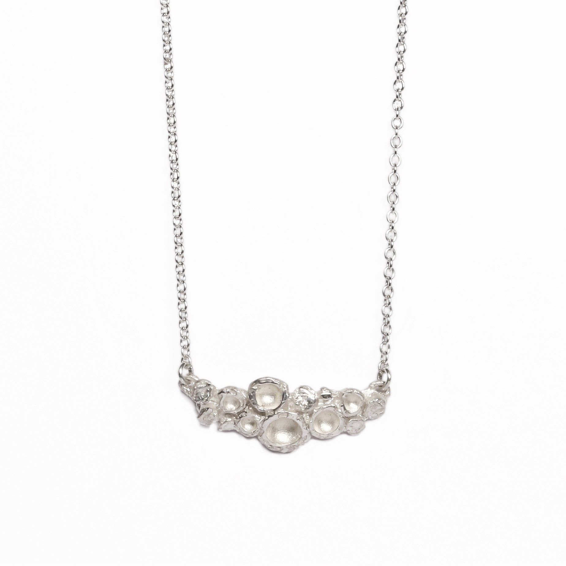 Etched silver Emerge bud pendant from Diana Porter's new collection 2017