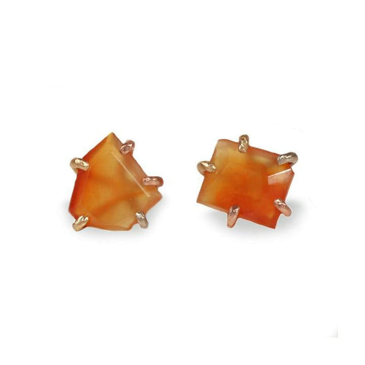Pair of orange square stud earrings on a white background