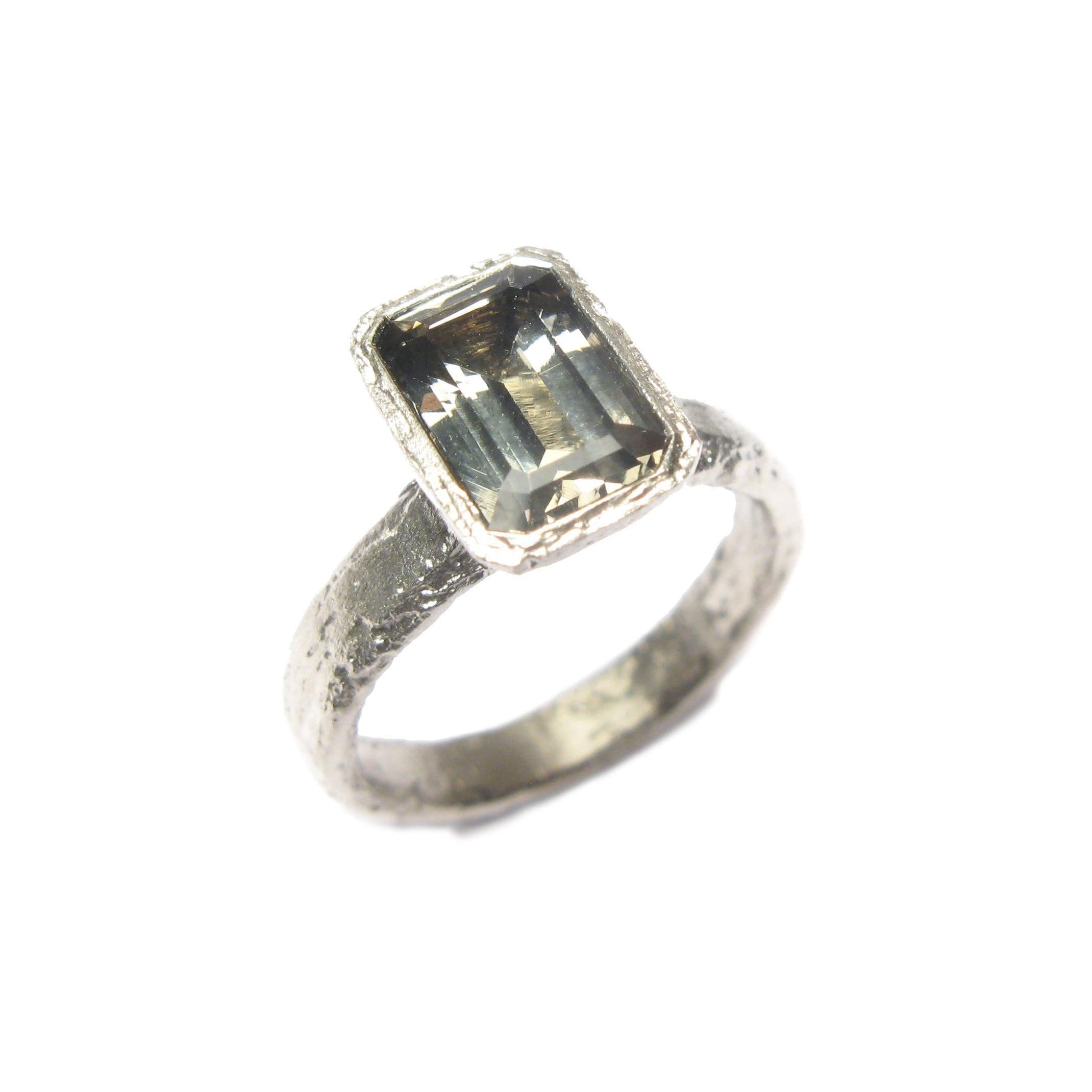 9ct white gold ring with customers own, emerald cut Zoisite.