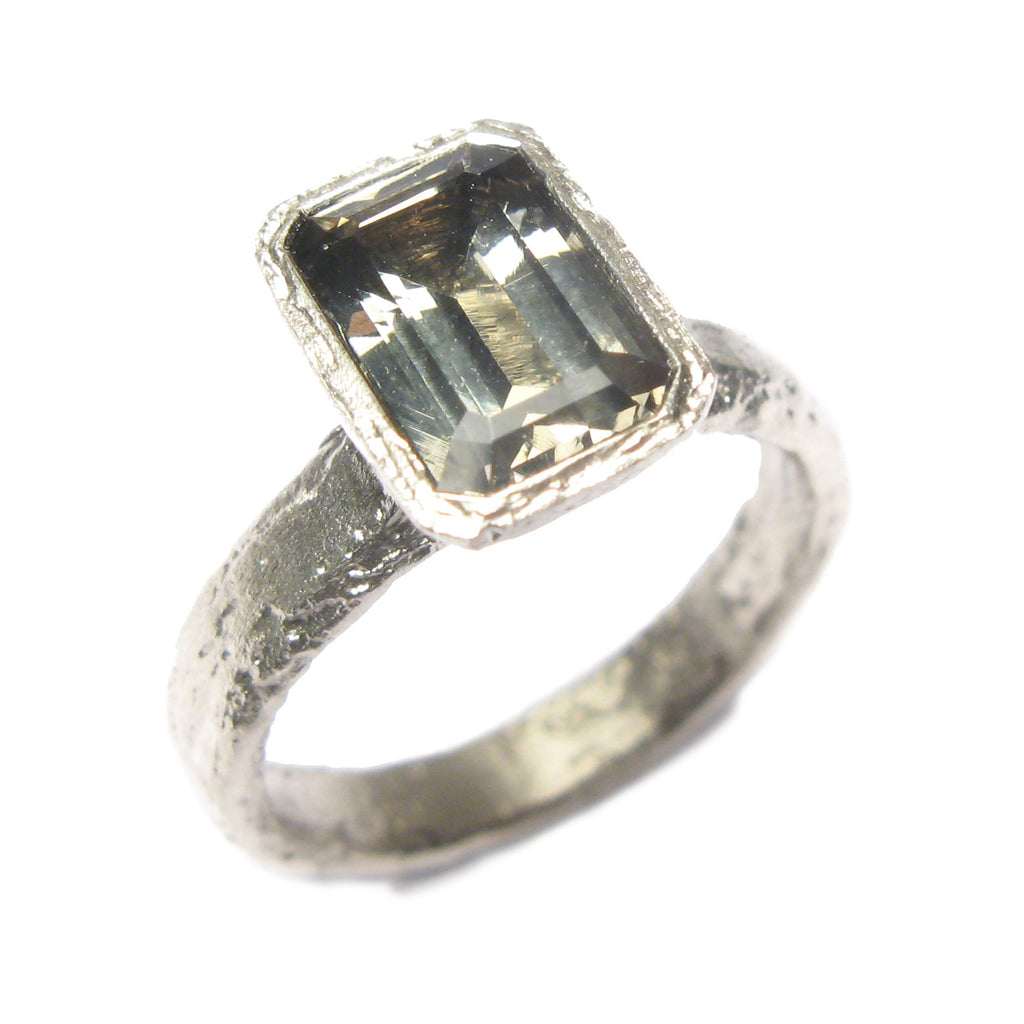 9ct white gold ring with customers own, emerald cut Zoisite.
