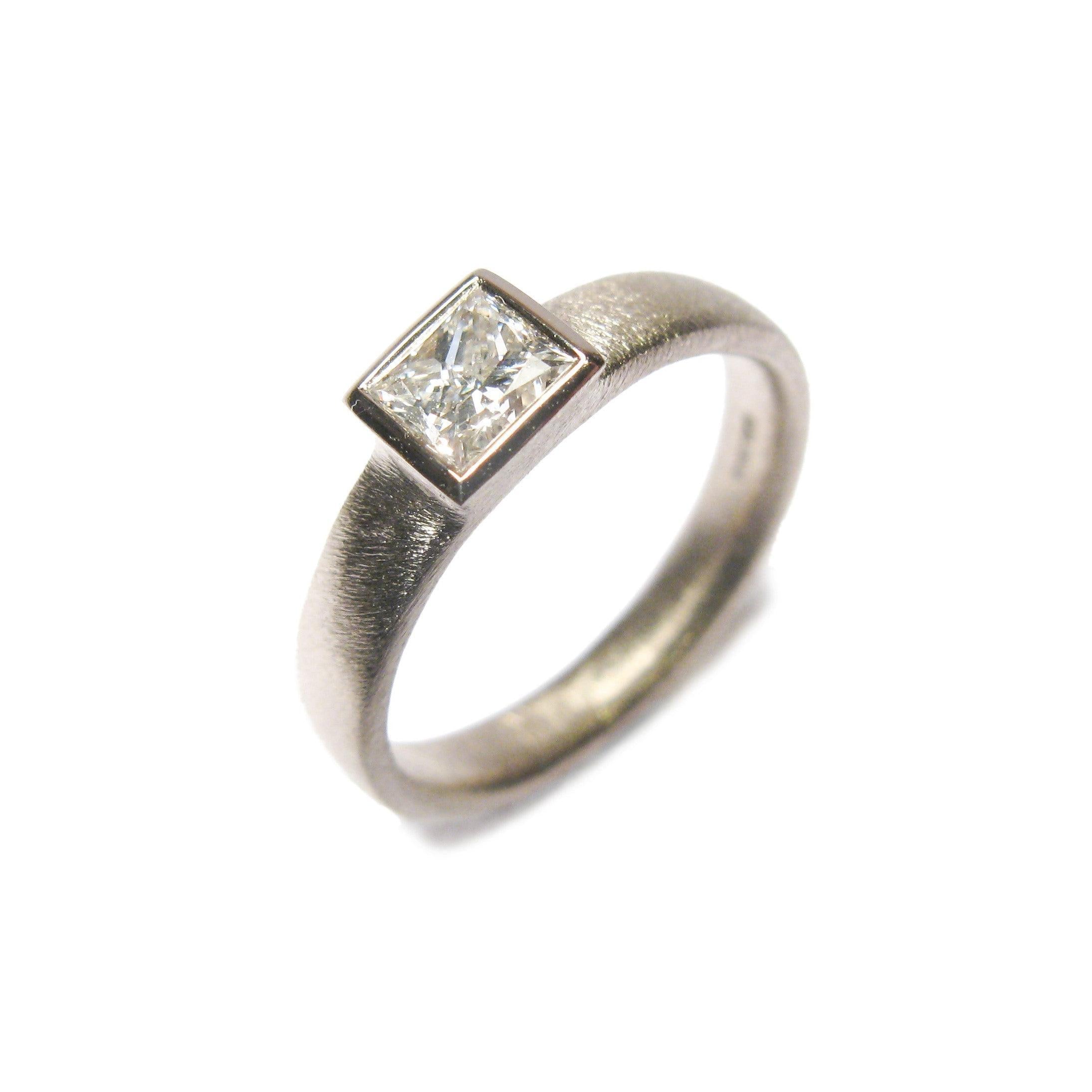 18ct White gold ring. Based on the AOJTNPC, adapted to take customers own princess cut diamond.