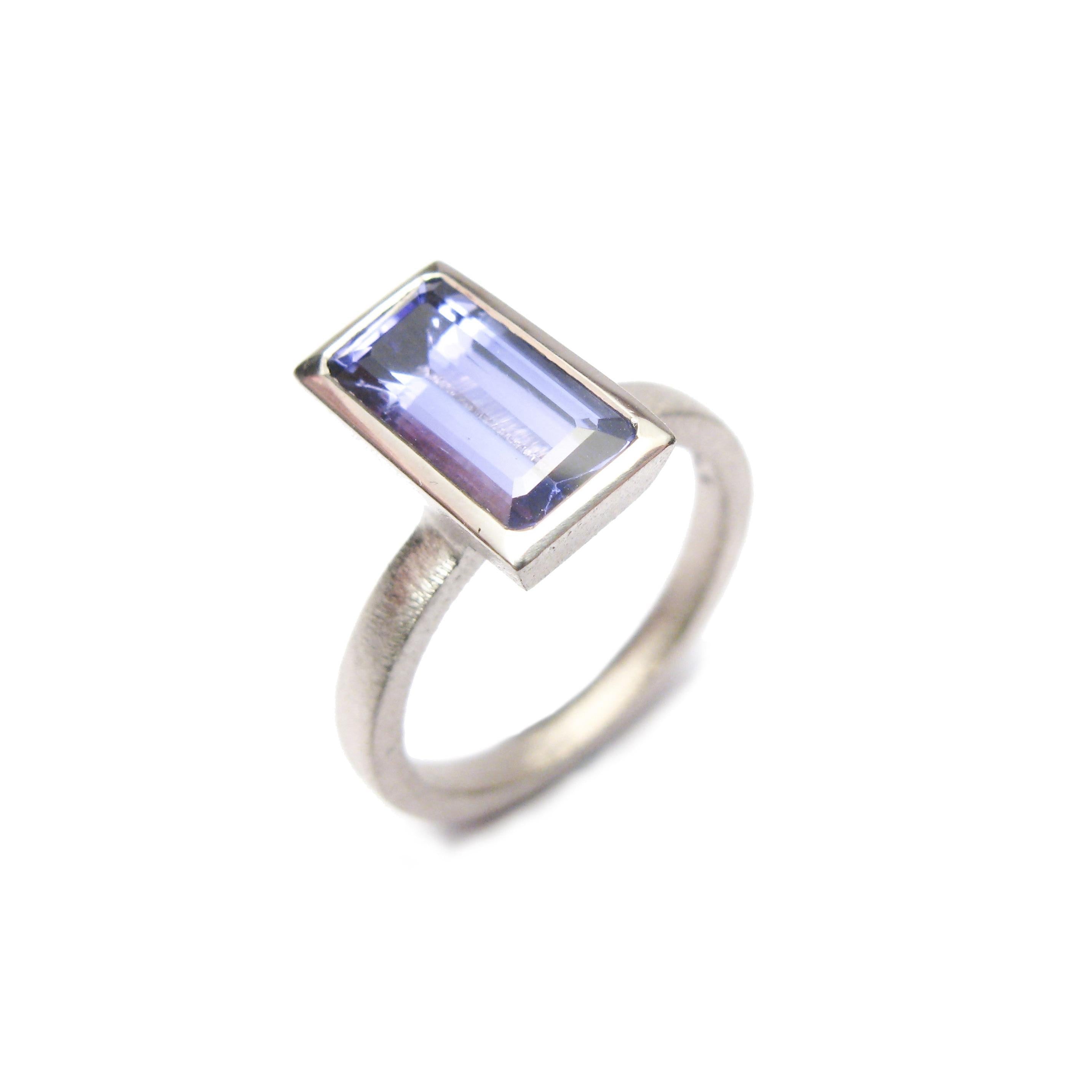 bespoke commissioned 18ct white gold ring with customers own, emerald cut, tanzanite