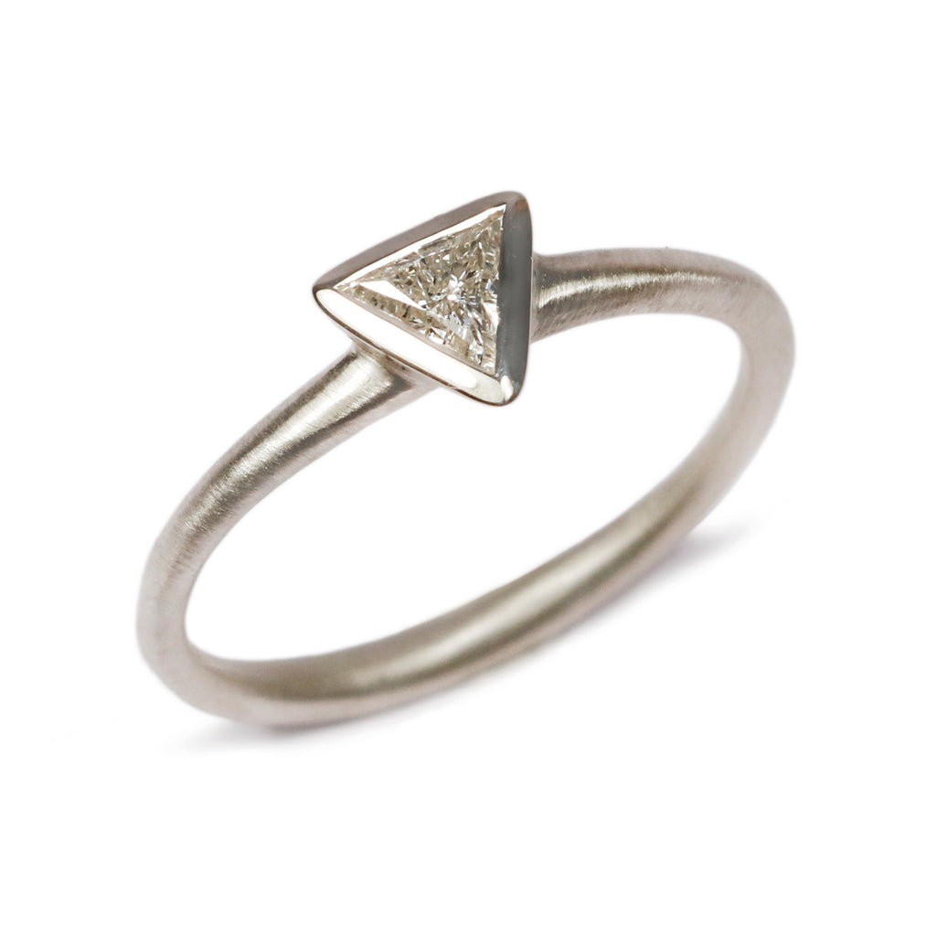 White Gold Ring with Trillion Cut Diamond on white background 