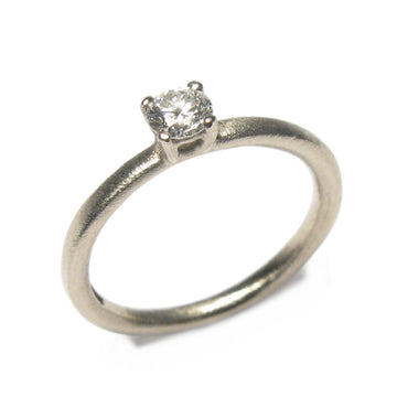 White Gold Ring with Claw Set Single White Diamond  on white background 