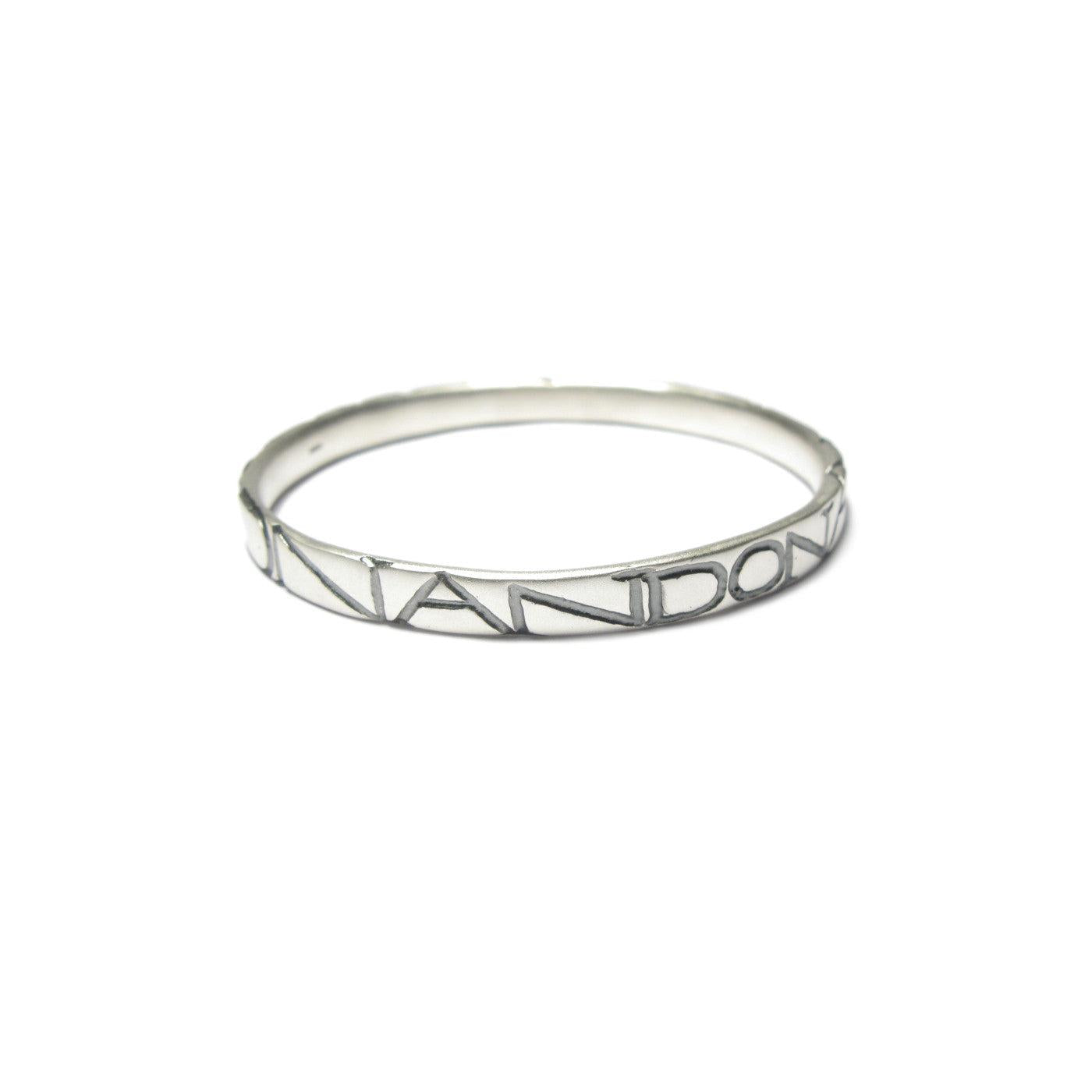 Diana Porter etched on and on silver bangle