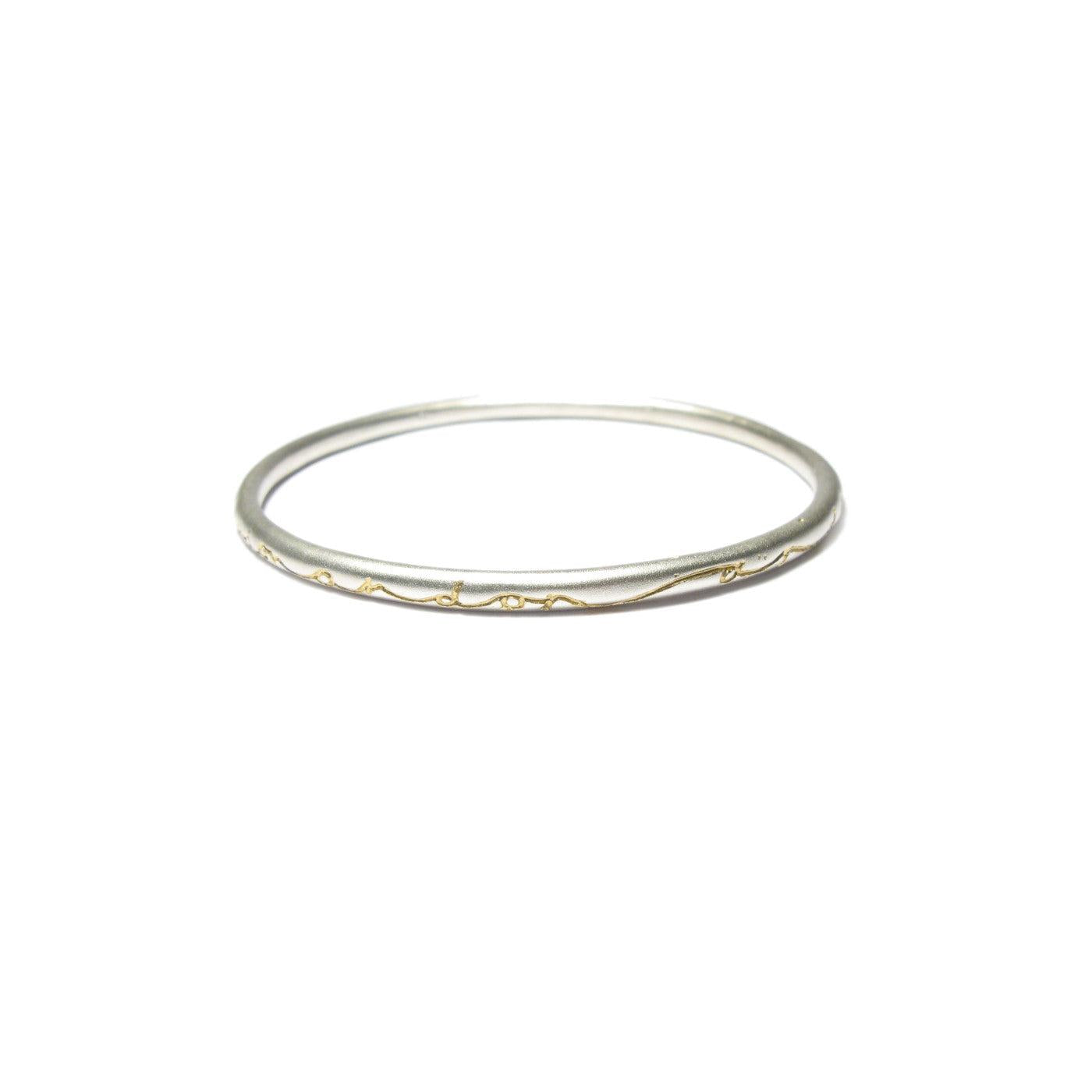Diana Porter etched on and on silver gold bangle