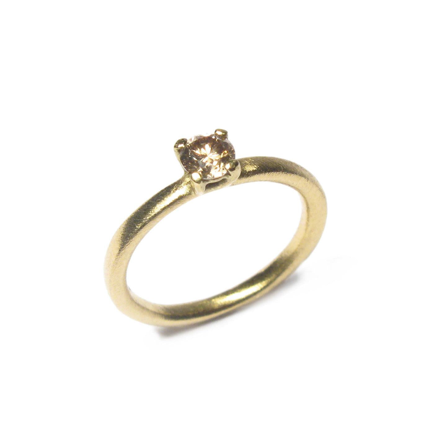 Yellow Gold Ring with Claw Set Single Champagne Diamond on white background 